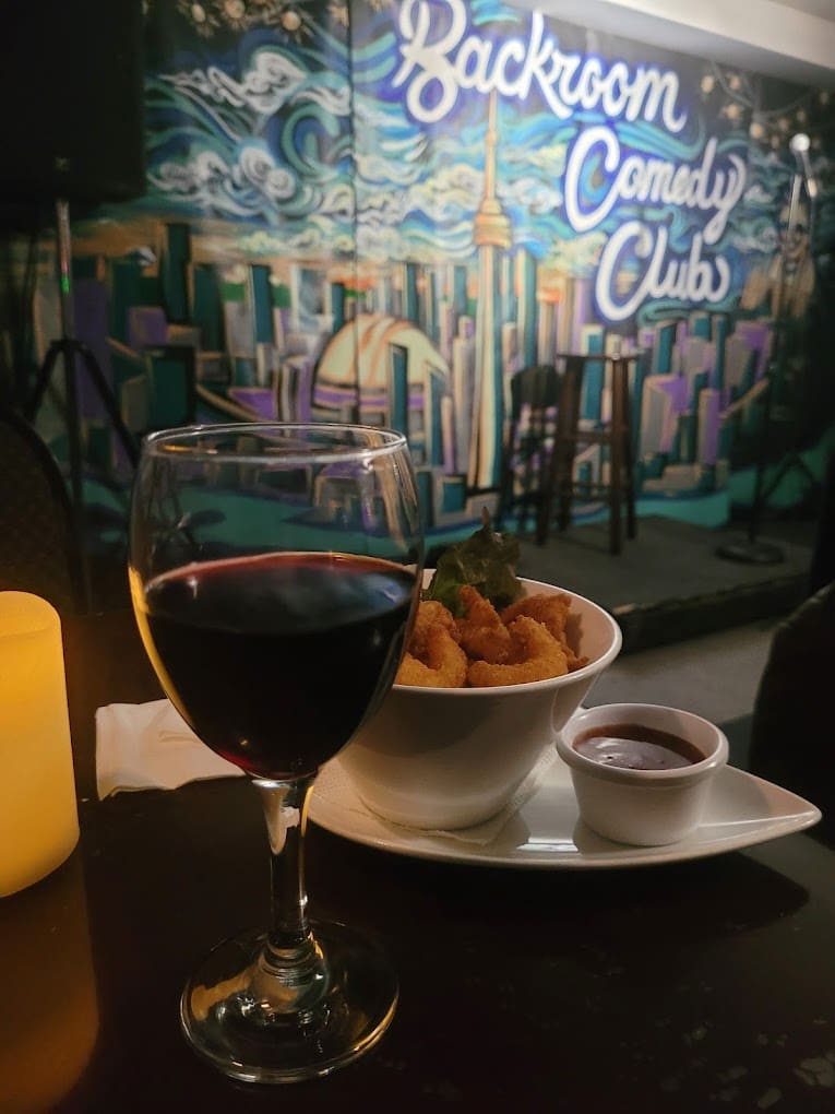 Delicious wine with a meal at Backroom Comedy Club